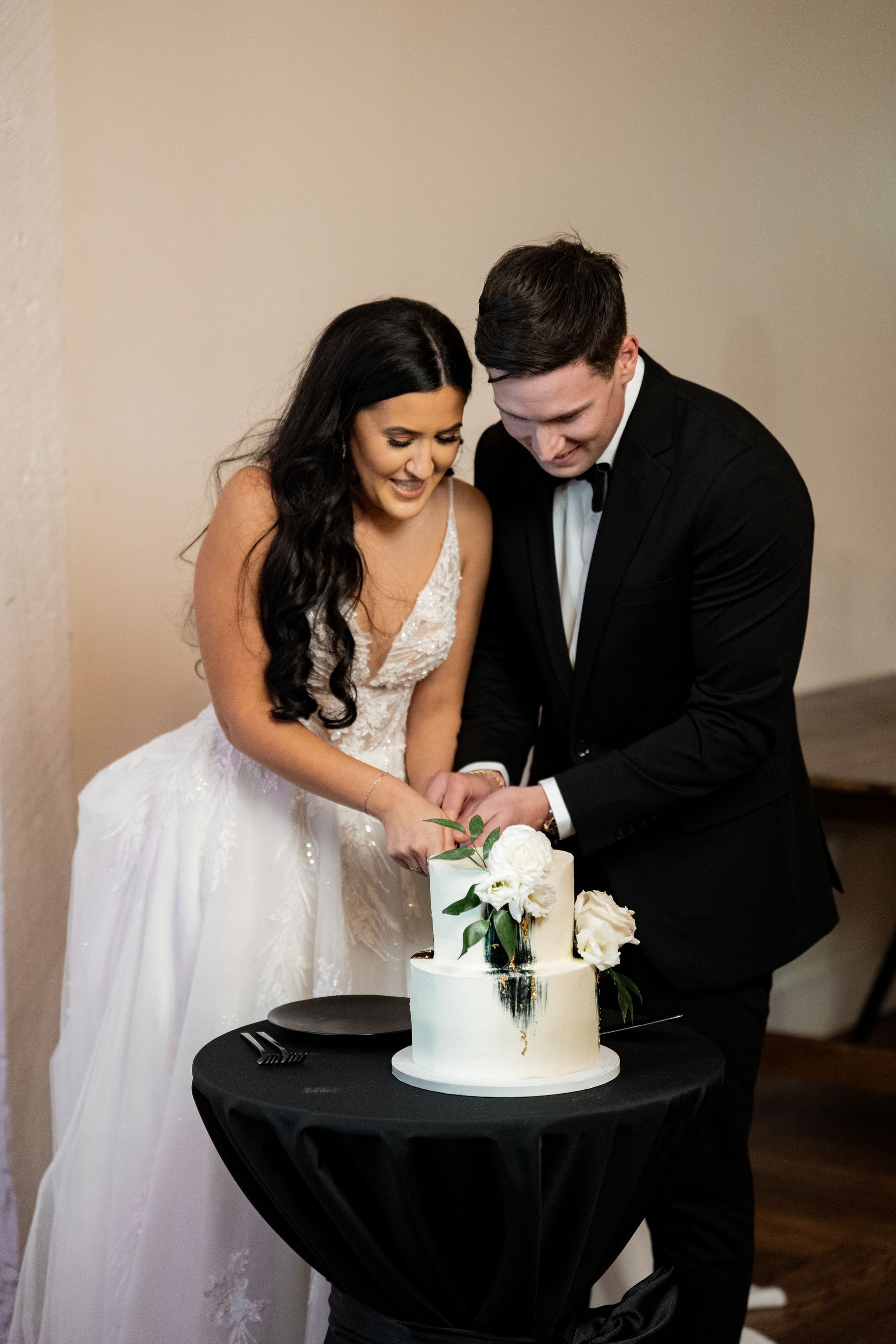 Nashville bride and groom cutting the cake. Photographed by a Nashville Wedding Photographer
