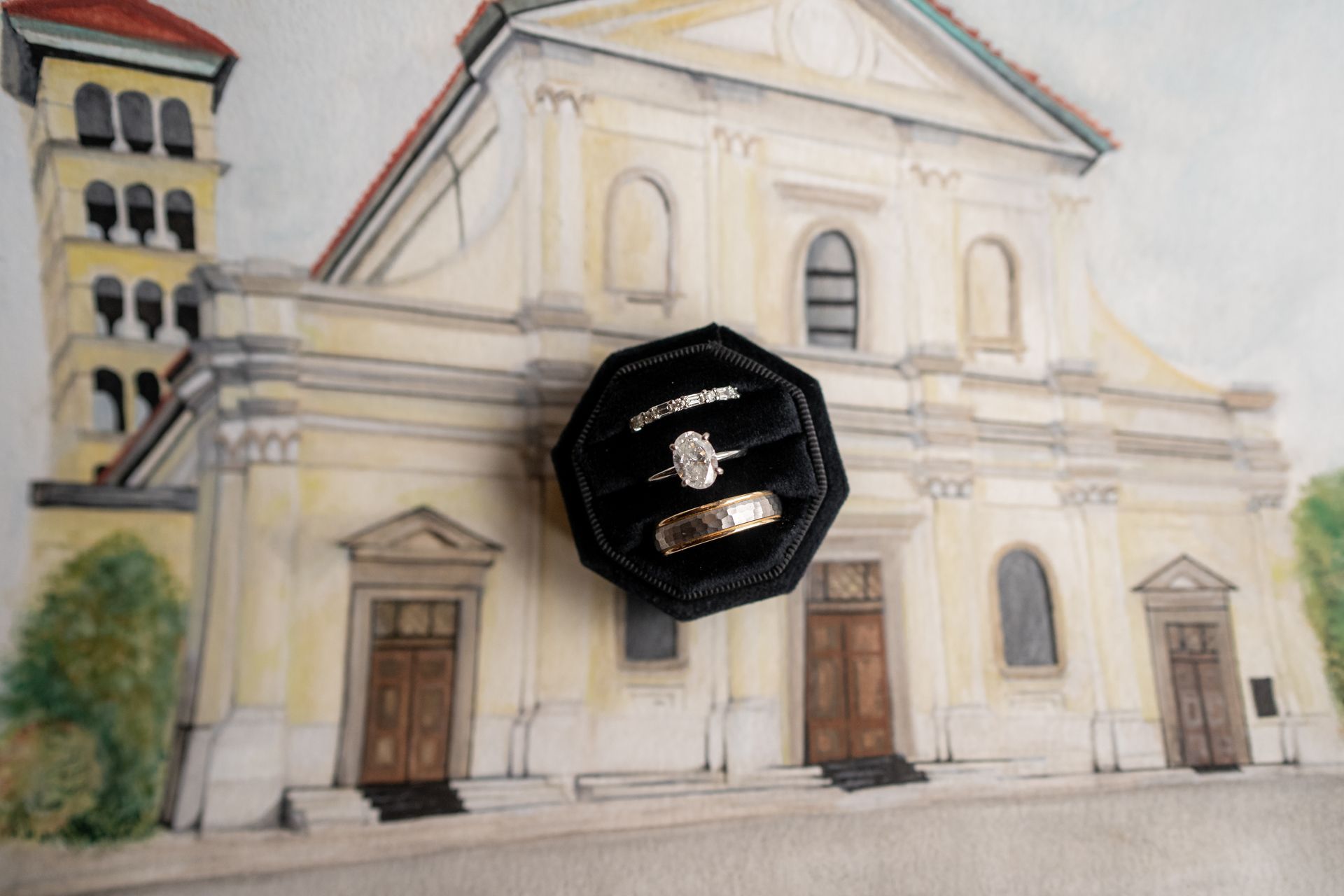 Nashville wedding detail image of a wedding ring and a drawing of a cathedral where the wedding ceremony took place.