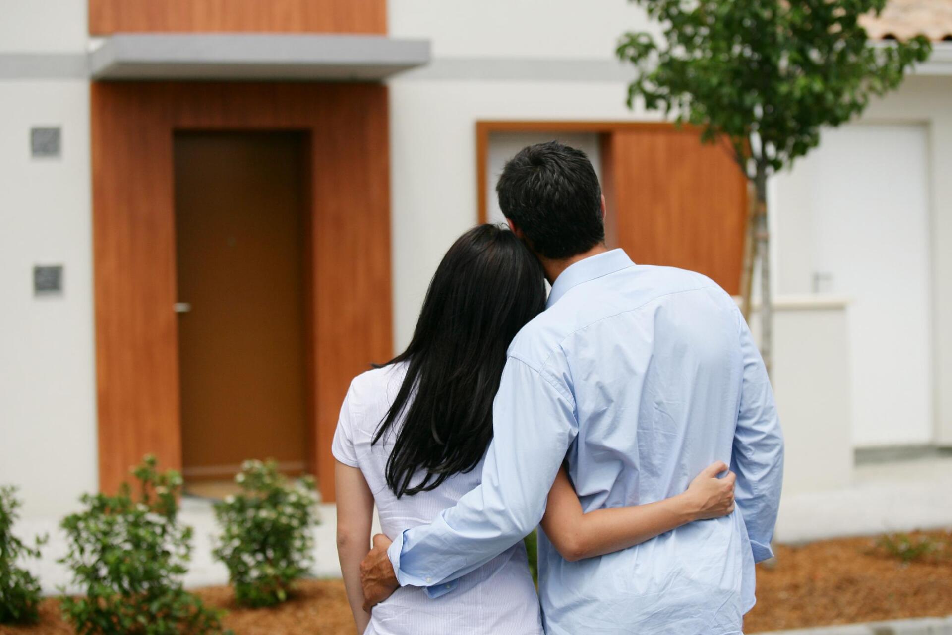 two couples hugging each other