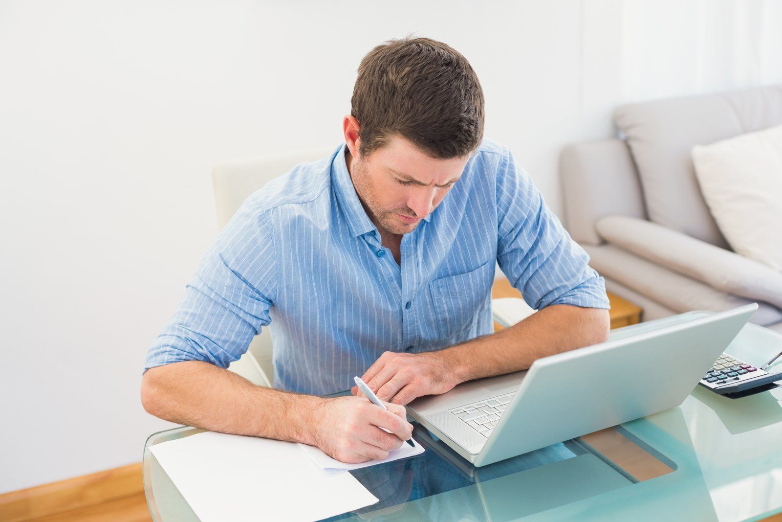 man writing on the paper