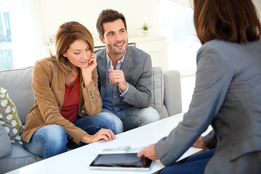 woman talking to the couples