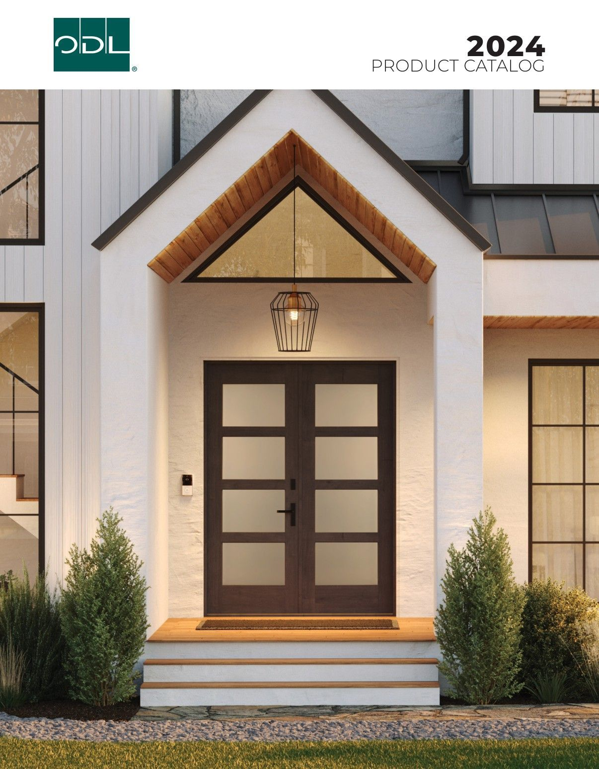 Front door with sidelights; modern home exterior. Door is brown with frosted glass panels; white siding.