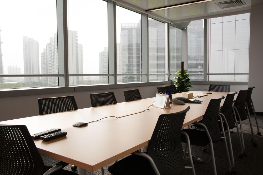 Conference Room with A Long Table, Chairs, and Newly Installed Tint Windows — Total Tint Bendigo in Maiden Gully, VIC
