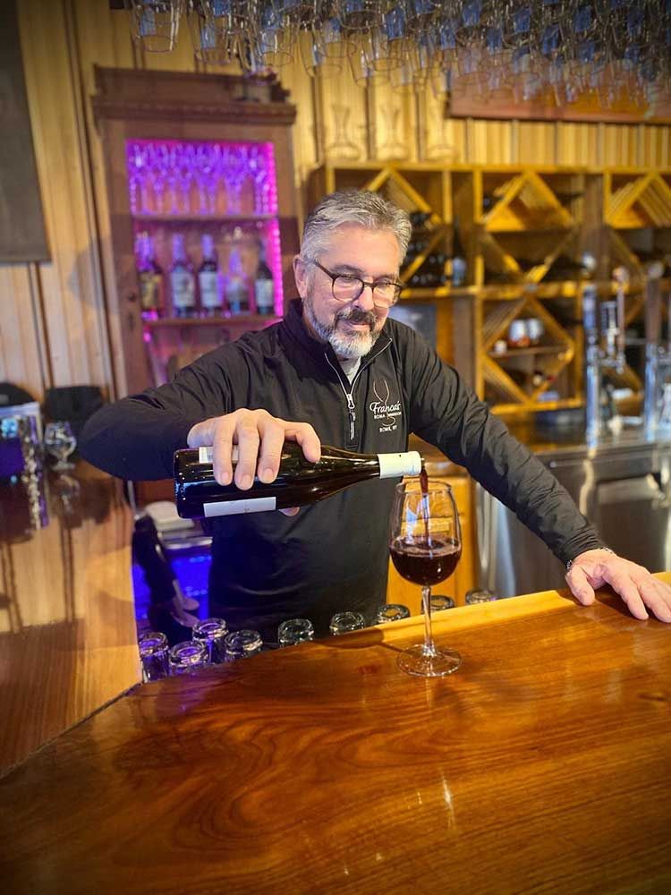 Paul pouring wine