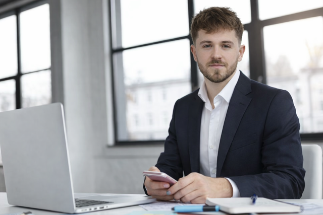 Liam Taylor, founder of LAT Property Investments, at his desk