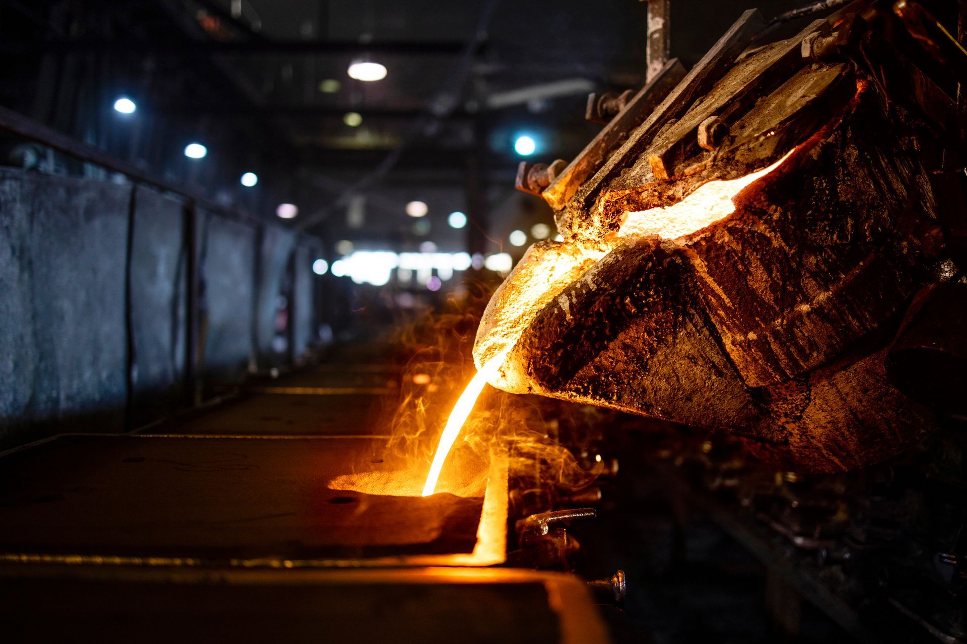 Molten iron being poured from a ladle.