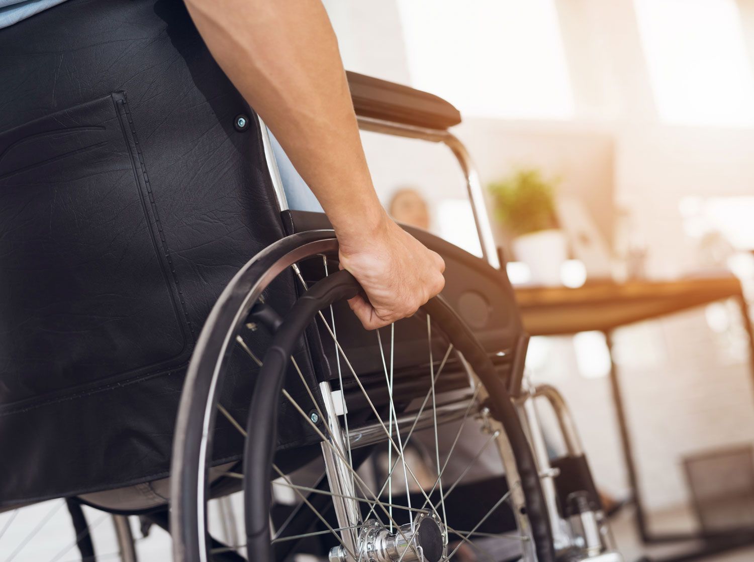 a disabled man is sitting in a wheelchair