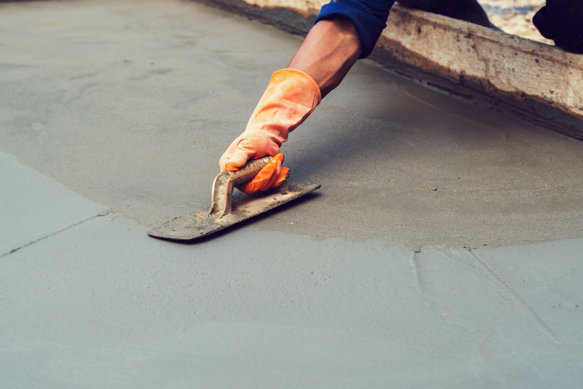 Masonry repair contractor using stainless steel trowels to plaster local polished cement surfaces. Masonry repair contractor using stainless steel trowels to plaster local polished cement surfaces.