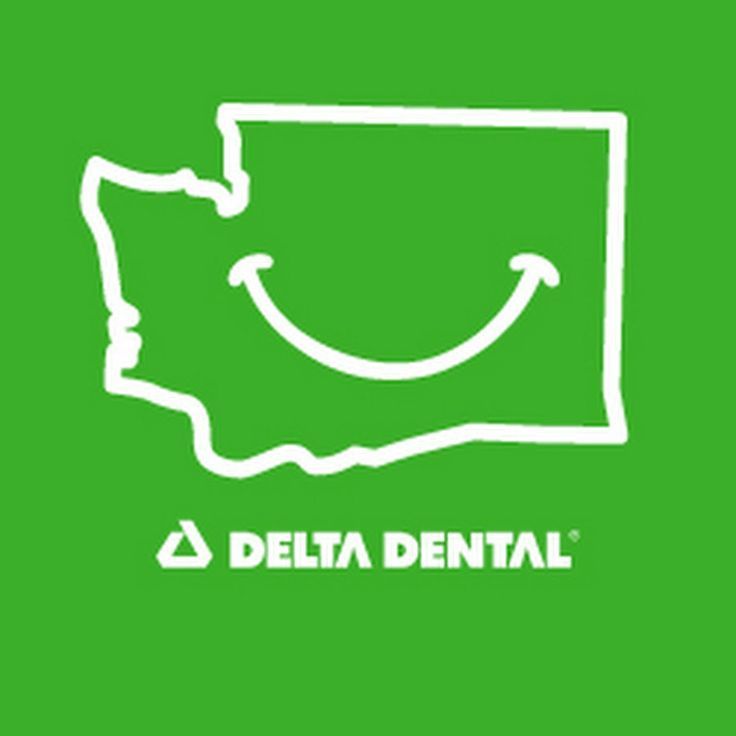A delta dental logo with a smiley face on a green background.