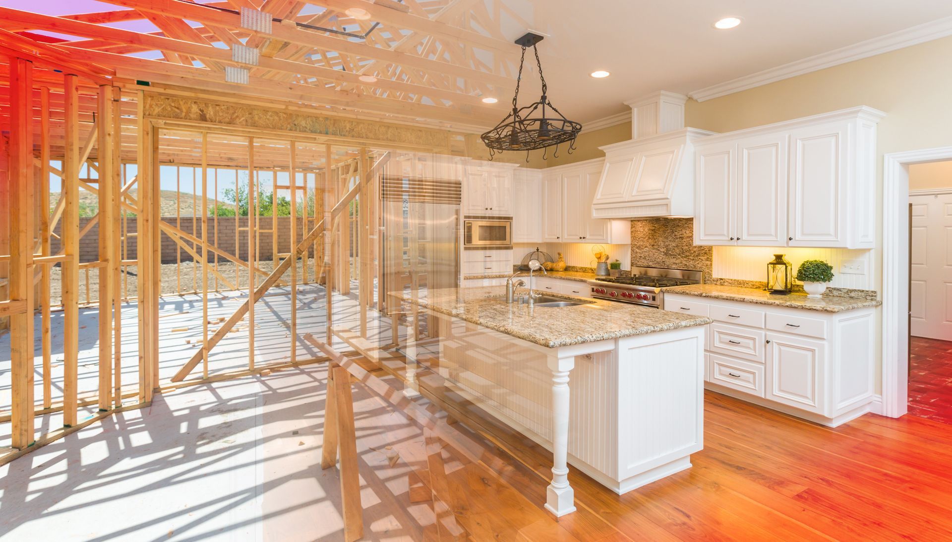 Bright kitchen with white cabinets, marble island, hardwood floors, and unfinished wooden framing on the left