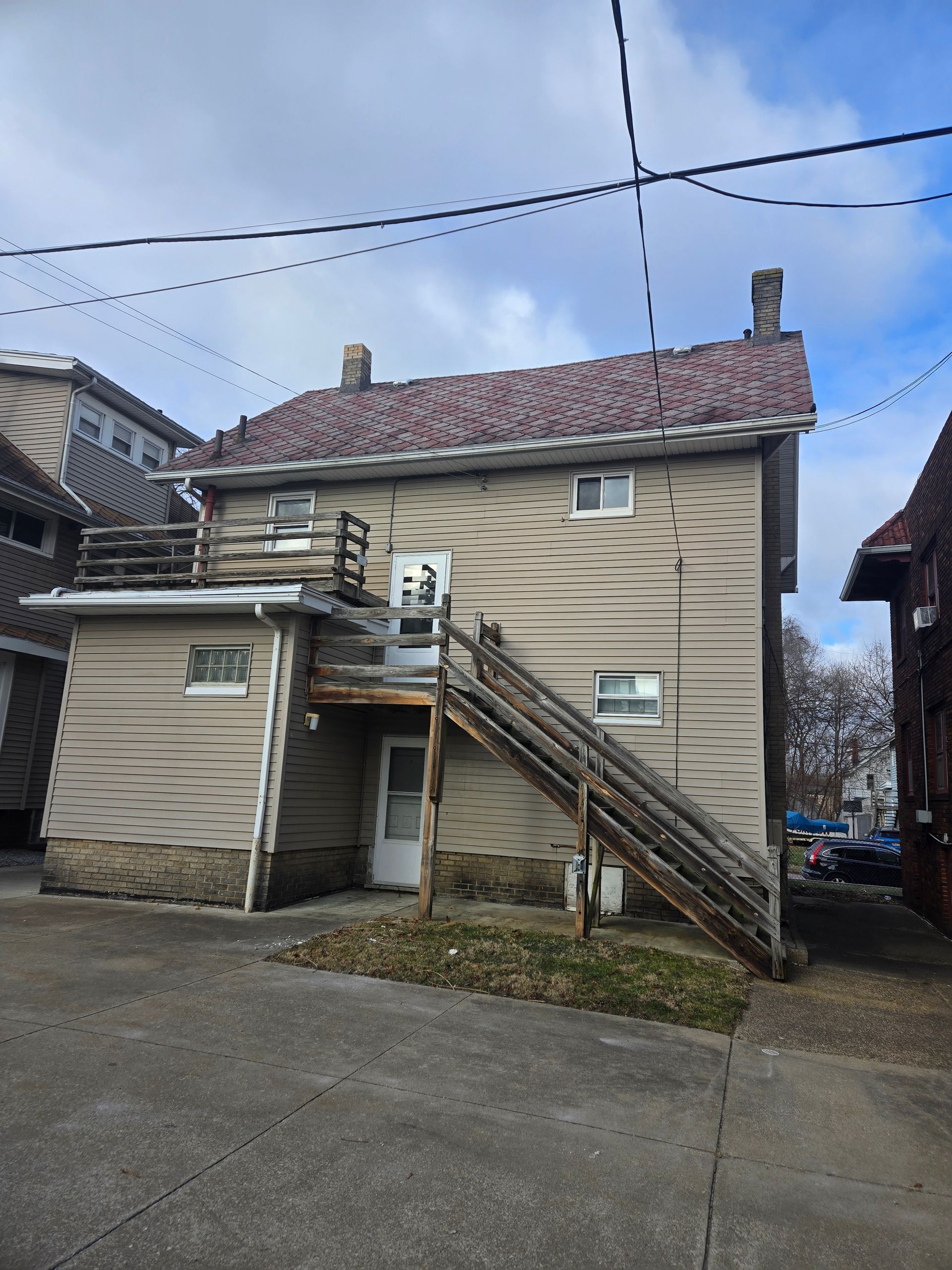 Back of duplex exterior photo of 115 Dawes Ave in Edison Park Community of Akron.