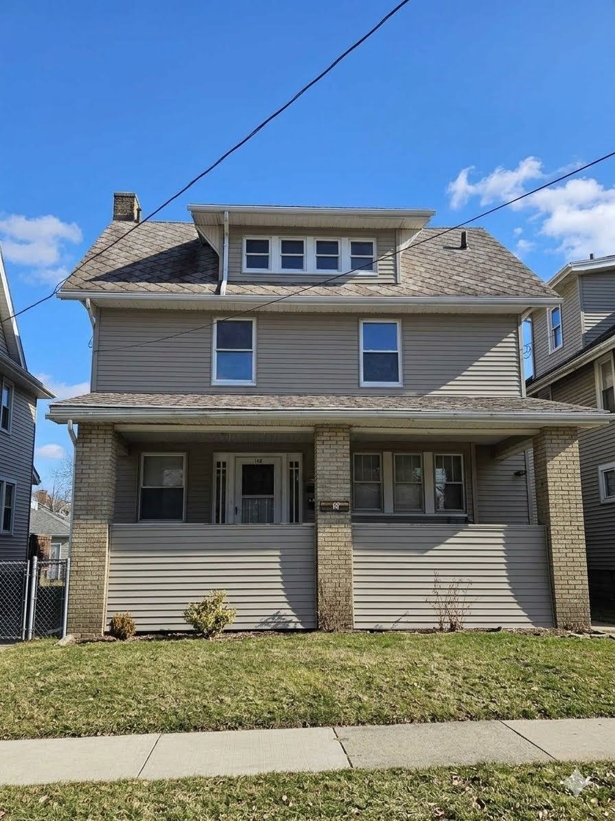 Front of duplex exterior photo of 115 Dawes Ave in Edison Park Community of Akron.