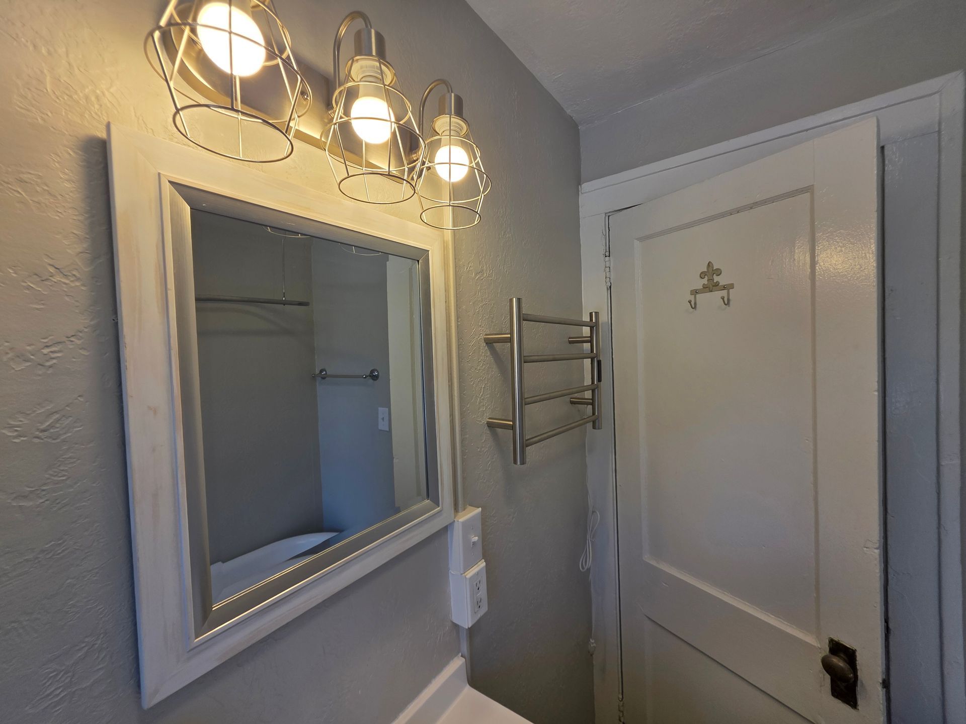 Clean, refreshed bathroom finishes with towel warmer at 146 King Drive Unit 3 rentals