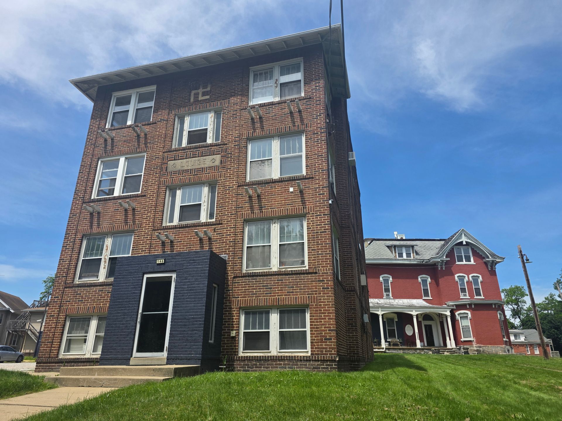 Charming historic brick multi-family apartment building exterior on King Drive in Akron.