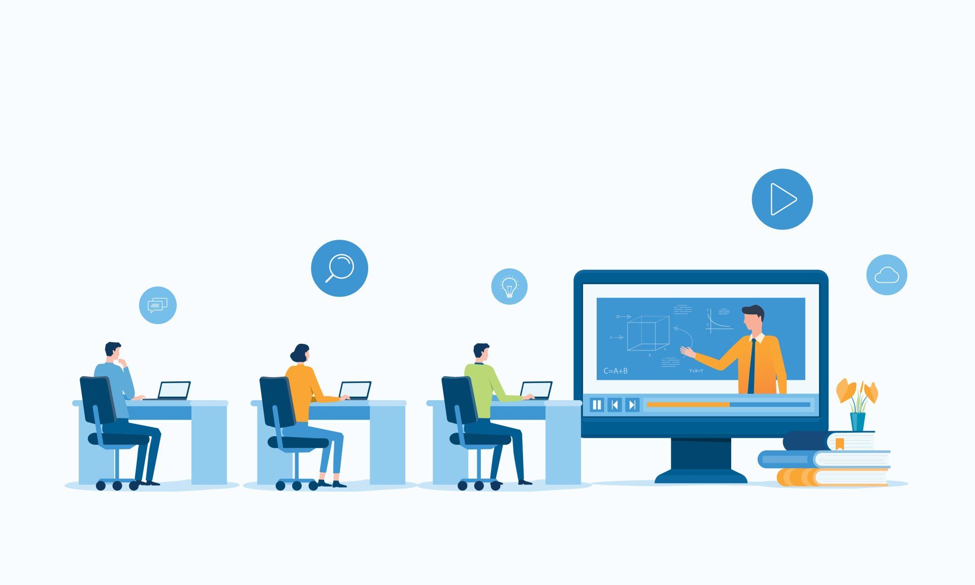 A group of people are sitting at desks in front of a computer monitor.