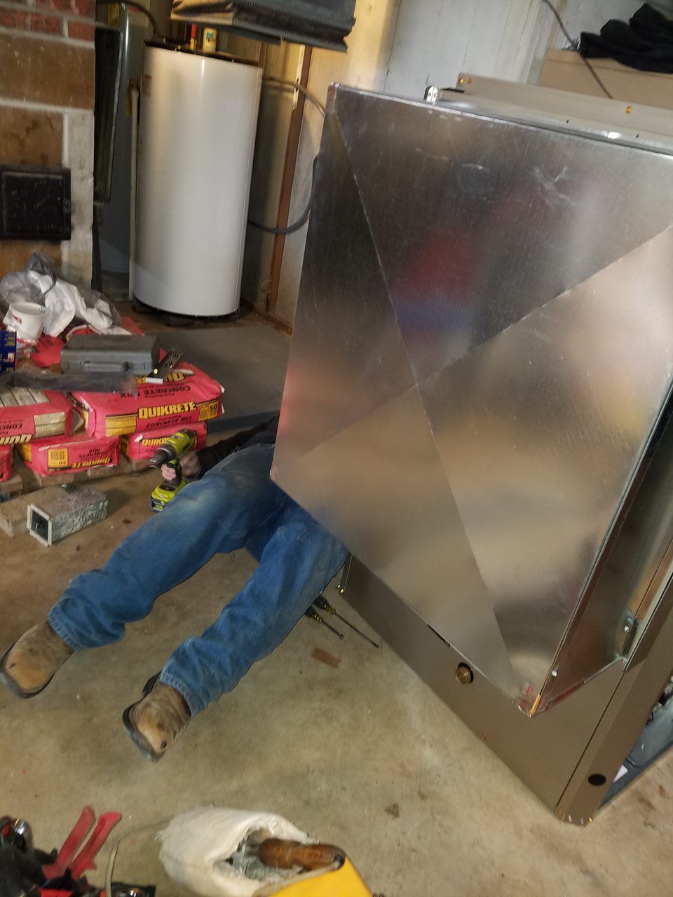 HVAC tech working in house