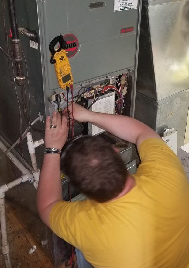HVAC tech working in house