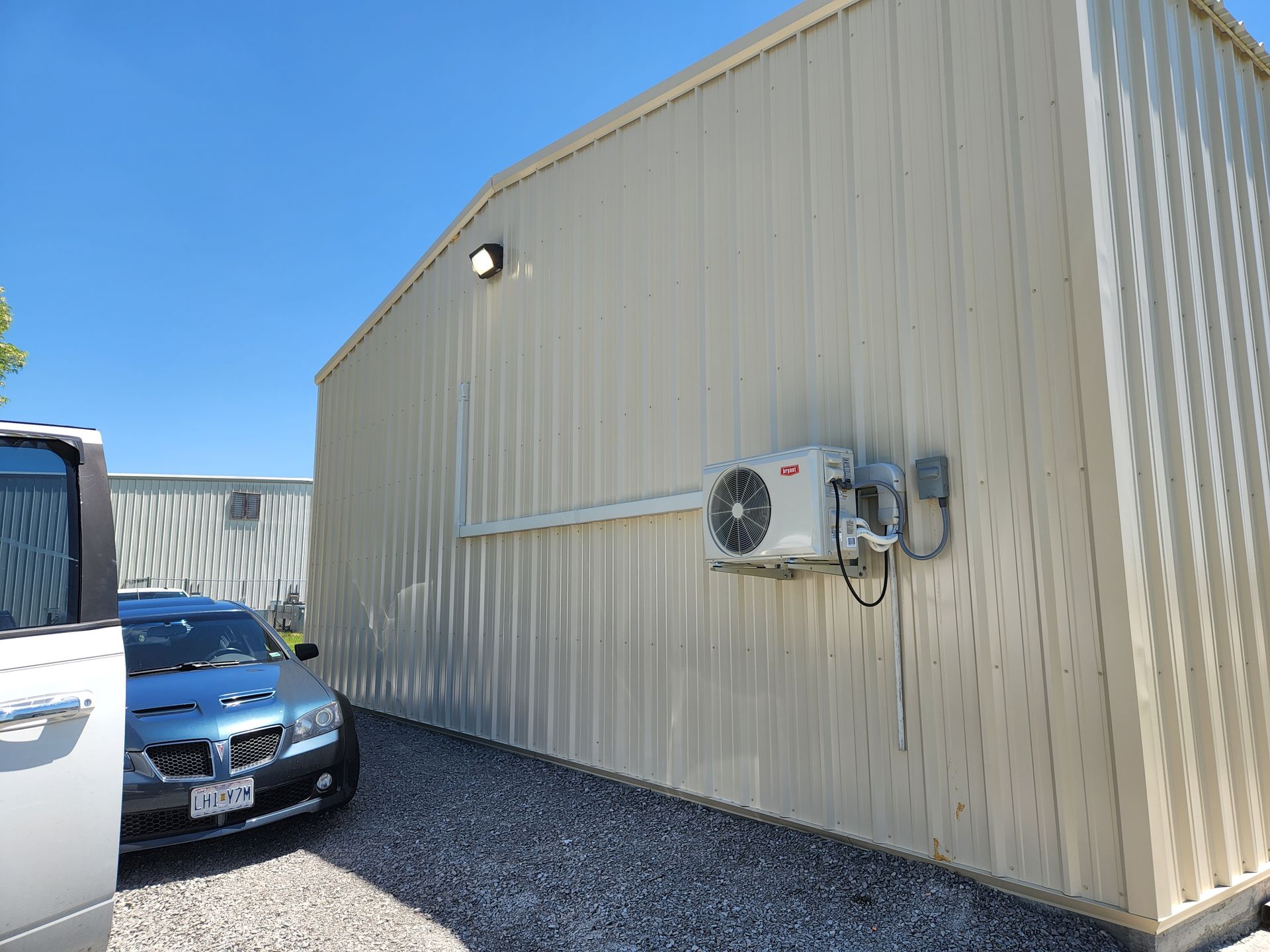 HVAC tech fixing air conditioner