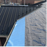 Roof deck and metal roofing materials during a professional metal roof installation