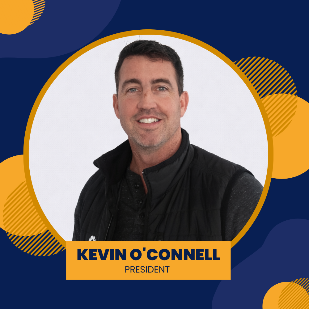 Kevin O'Connell, smiling, in a gray polo shirt, against a gradient background with yellow and blue shapes. 