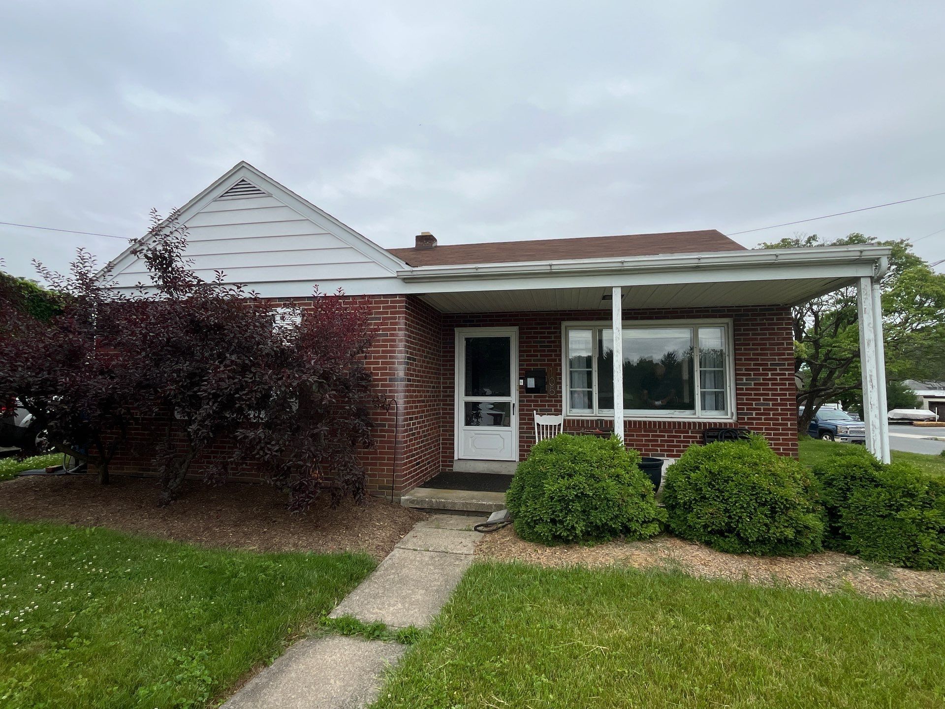 Single-story brick home on Lemon Street in Ephrata, PA with a newly replaced asphalt shingle roof designed to improve weather protection and extend roof lifespan.