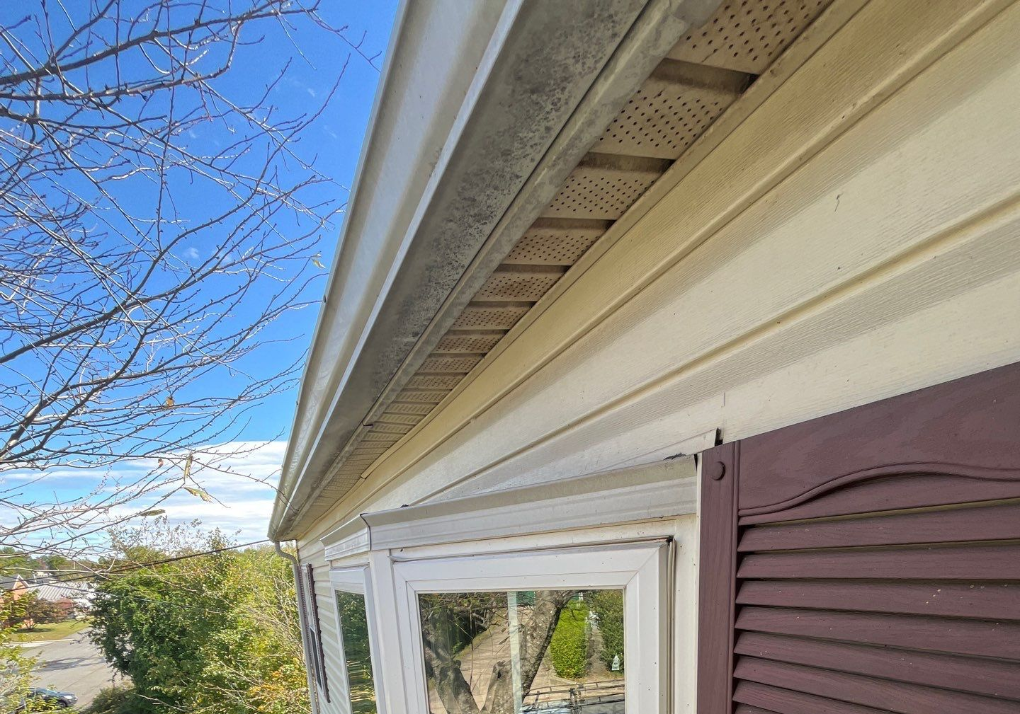Roofline soffit, gutter, and exterior trim detail from an Allen Road roofing project