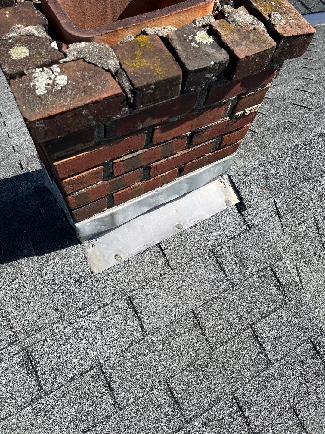 Chimney flashing repair on an asphalt shingle roof at a home on Annabeth Road in Oley, PA.