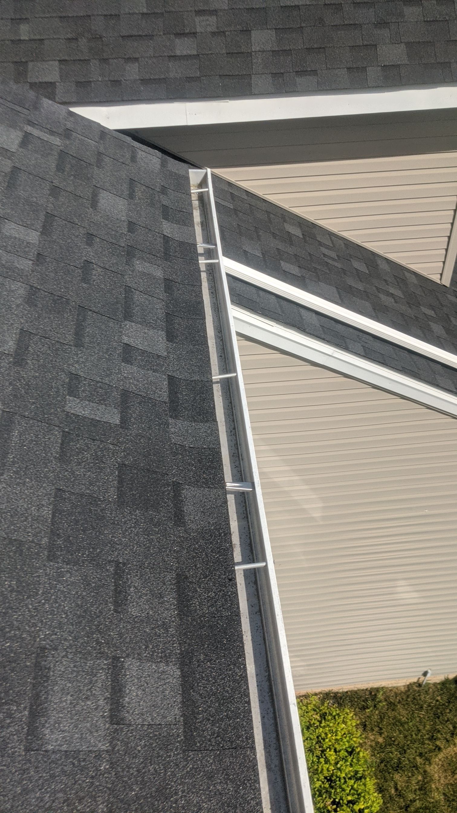 Detailed view of a newly installed architectural shingle roof and valley drainage system completed by Joyland Roofing in York, PA.