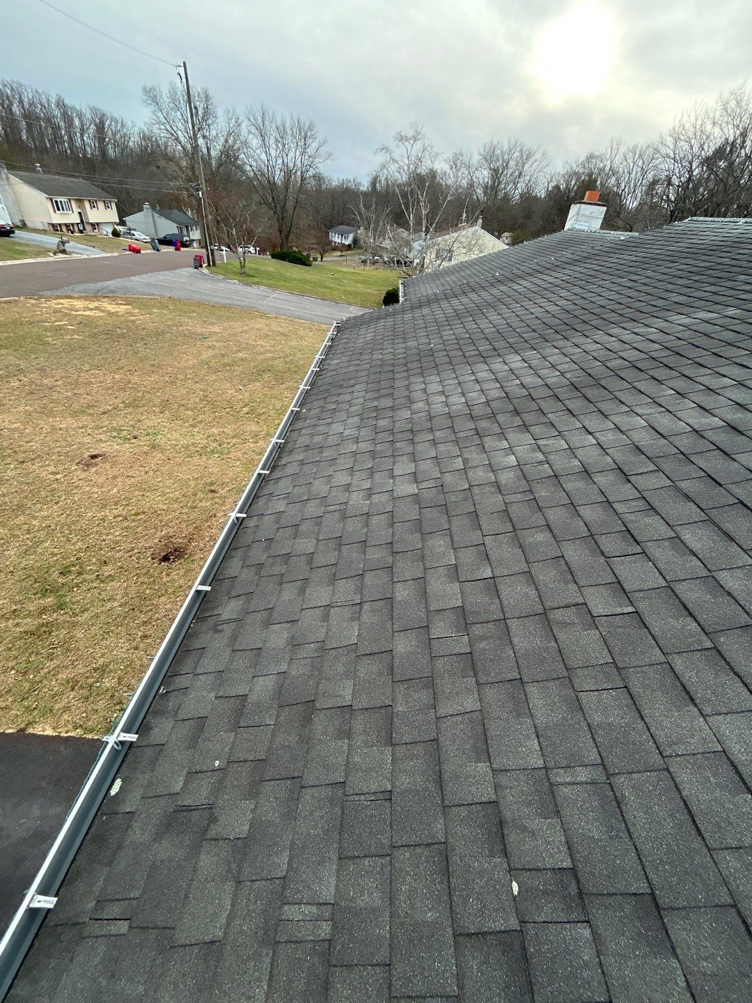 Asphalt shingle roof with visible aging and weathering along the roof slope on Randy Drive in Pottstown, PA