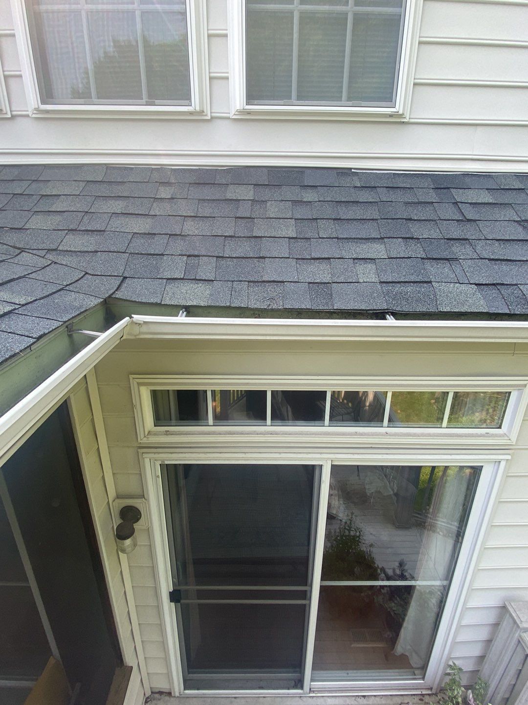 Asphalt shingle roof and wall flashing above an enclosed entry on Iris Lane in Glen Mills PA