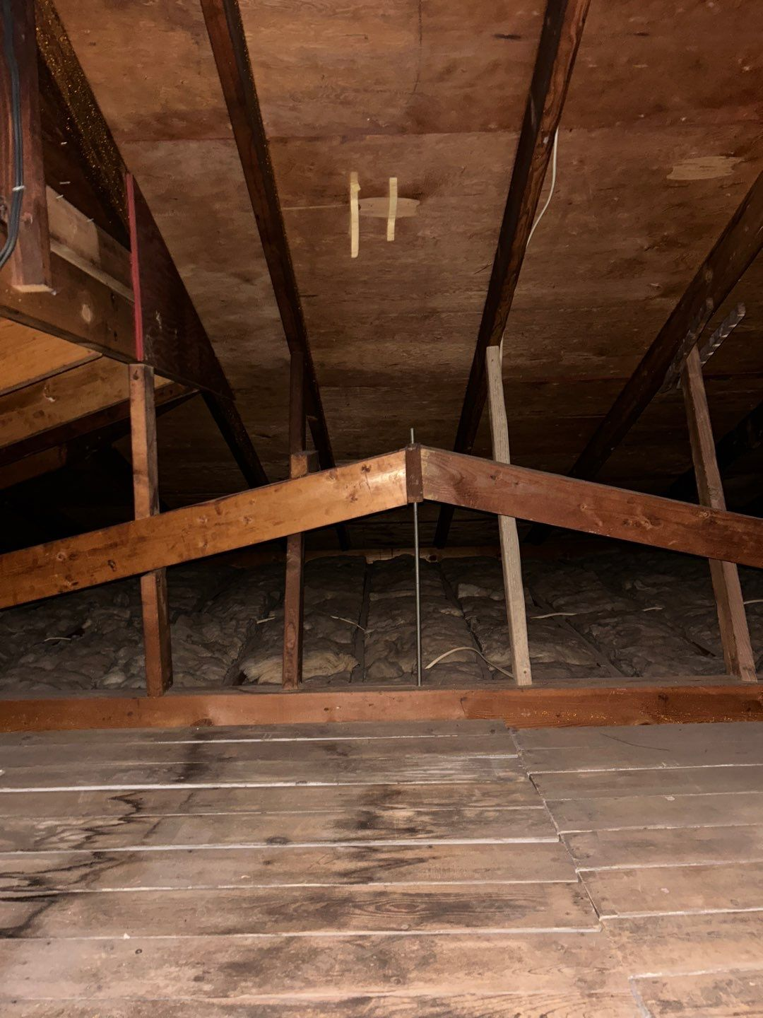 Interior attic inspection showing roof decking, rafters, and insulation at a home on South 5th Avenue in Schaefferstown, PA.