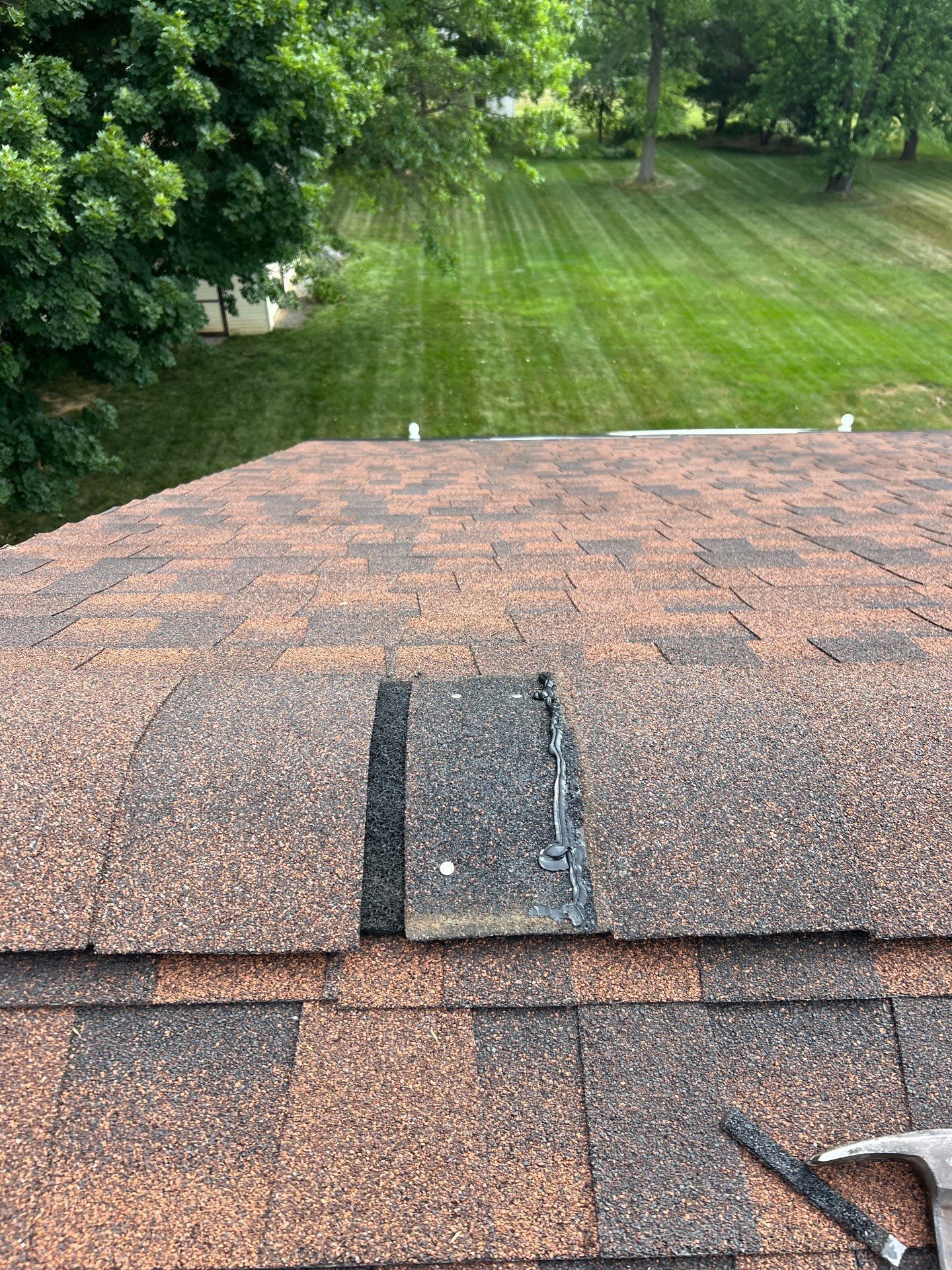 Asphalt shingle roof repair on Belle Alto Road in Wernersville, PA with replacement shingles professionally sealed by Joyland Roofing.