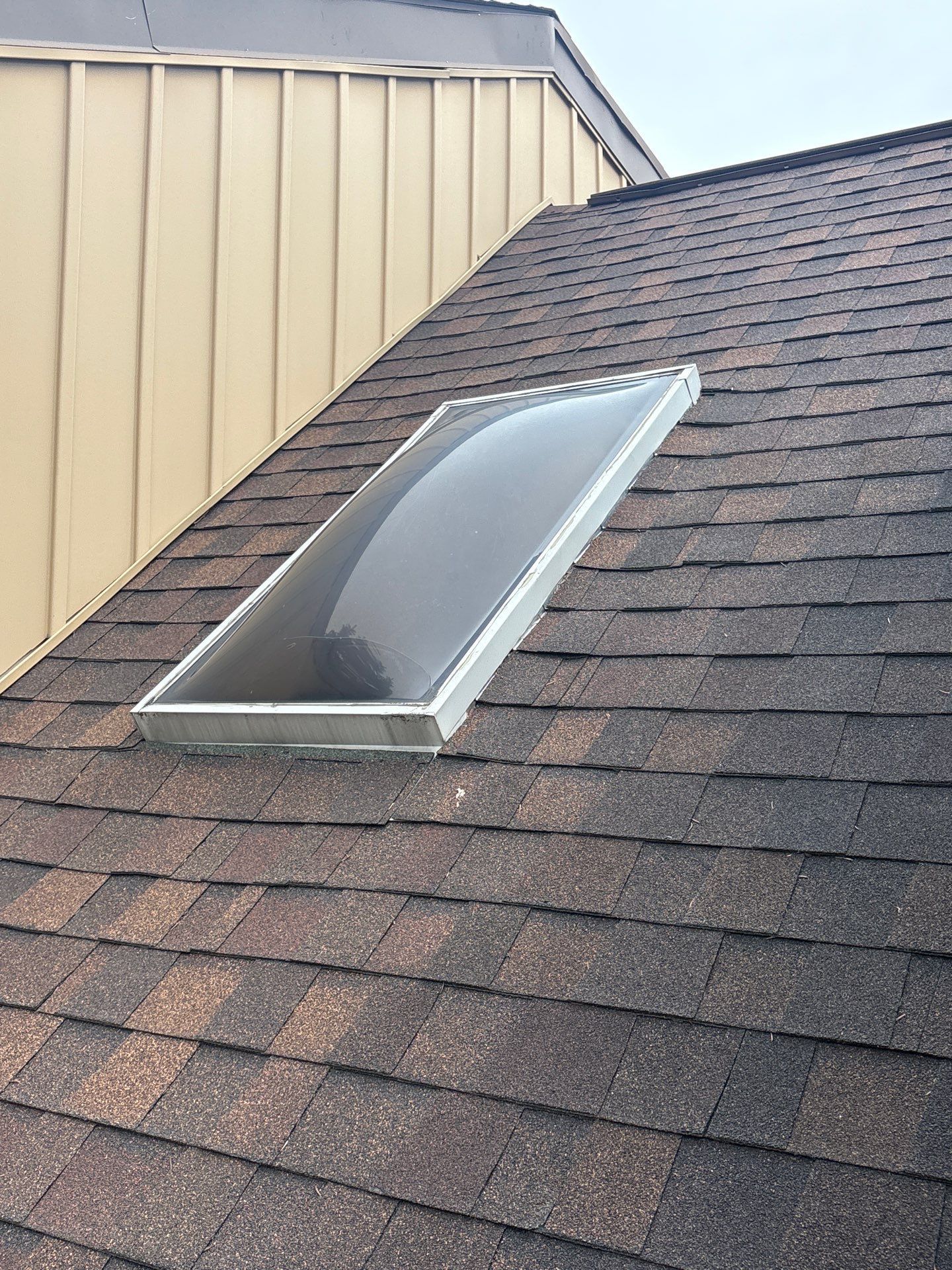 New asphalt shingle roof replacement with skylight completed on a home along Bradley Circle in New Cumberland, PA.