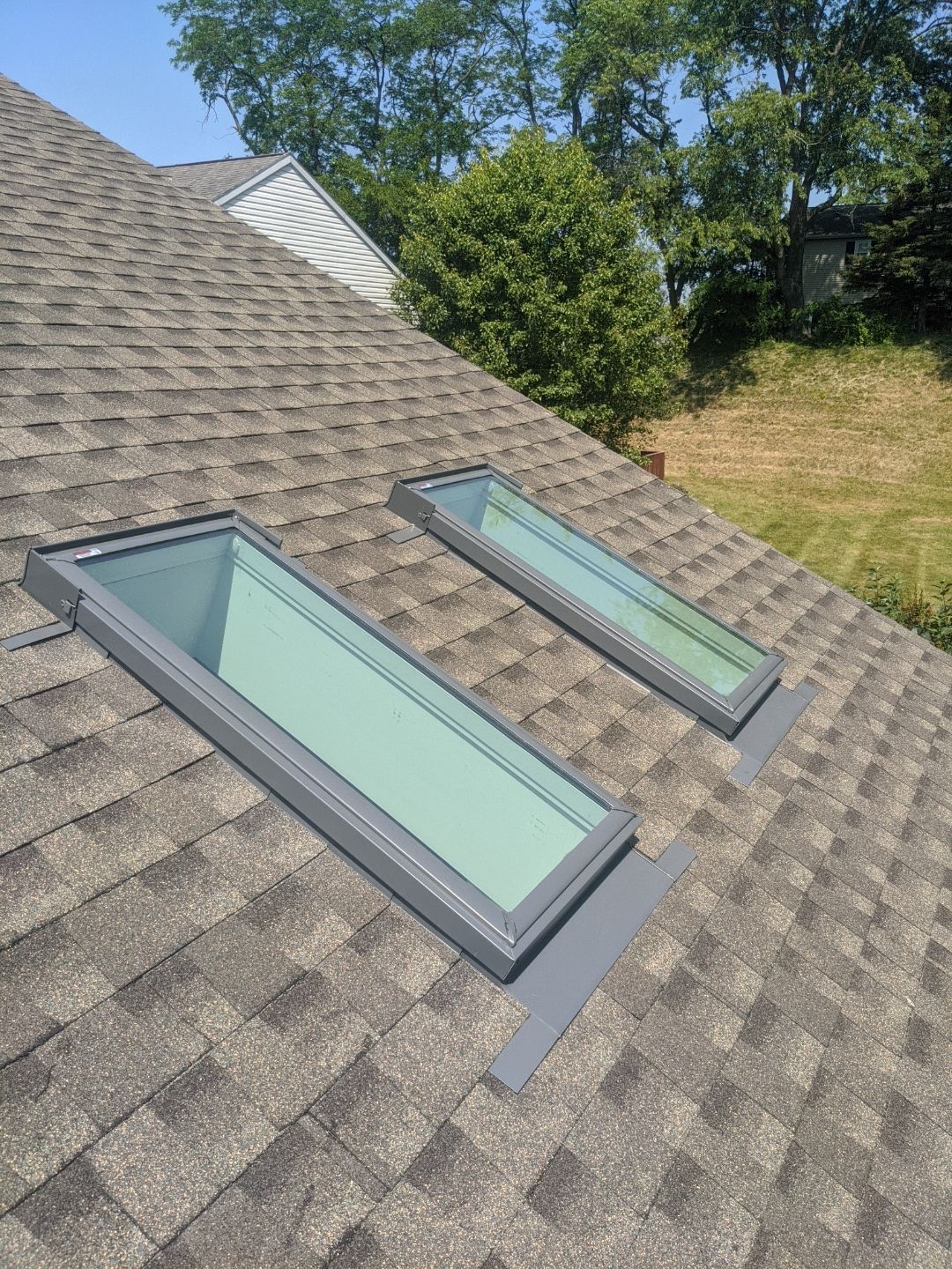 New energy-efficient skylights installed on an asphalt shingle roof on Broadwell Lane in Shepherdstown, PA.