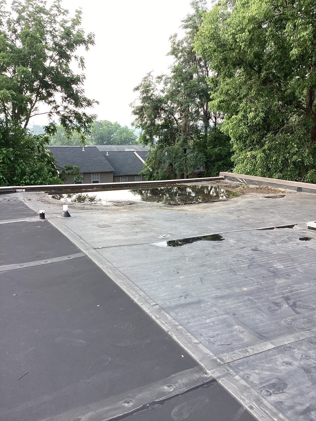 Flat roof with standing water before repair on Cedar Ridge Lane in Shepherdstown, PA.