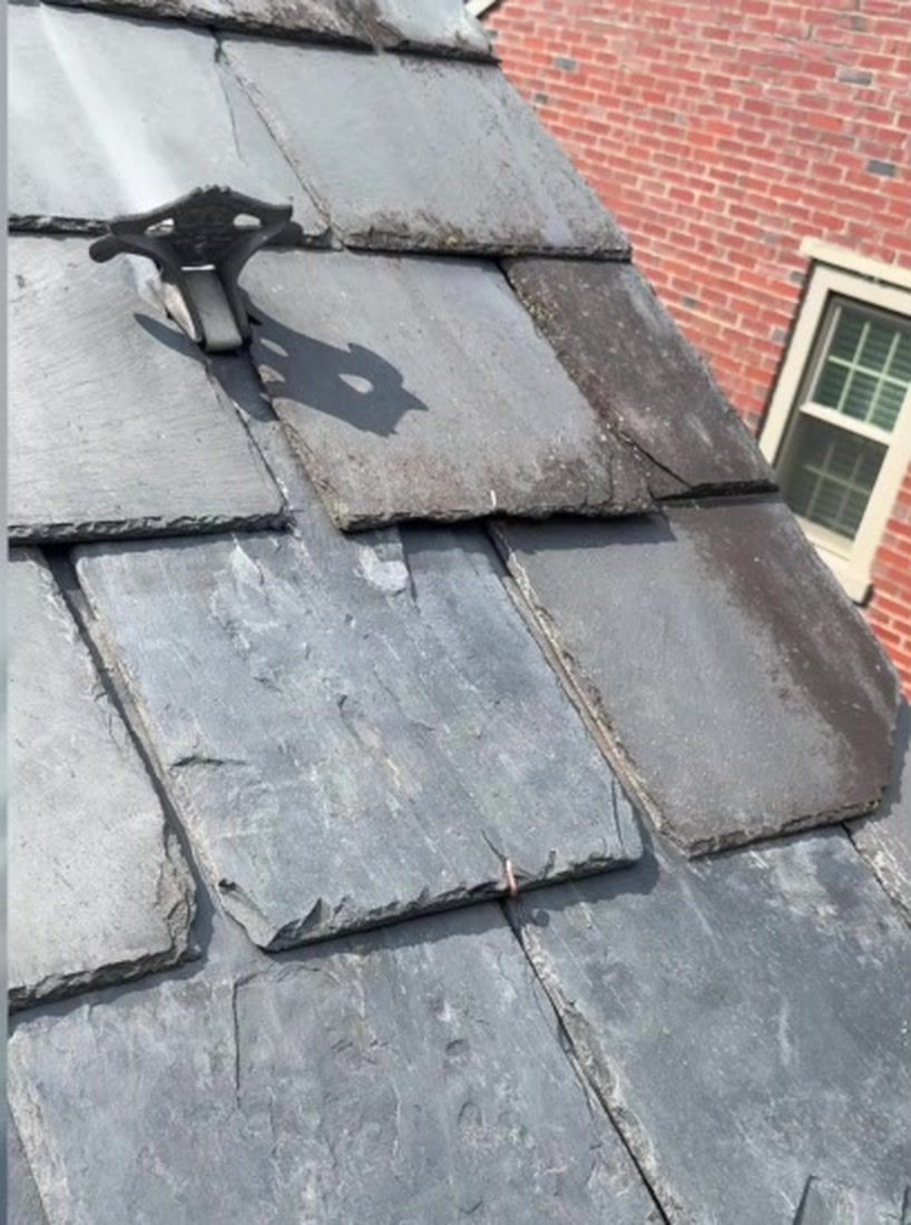 Completed slate roof repair after replacement tiles were installed on a Lancaster PA home