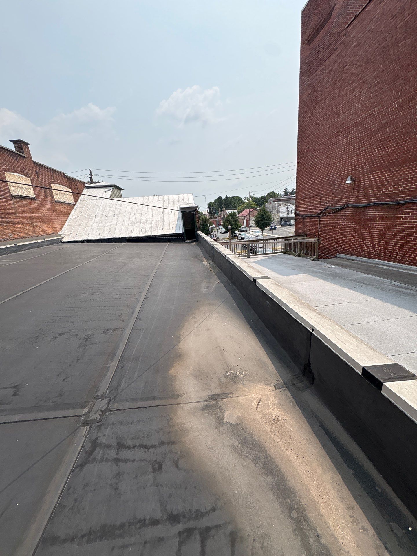 Commercial flat roof repair completed by Joyland Roofing on North Hanover Street in Carlisle, PA, restoring the EPDM roofing system.