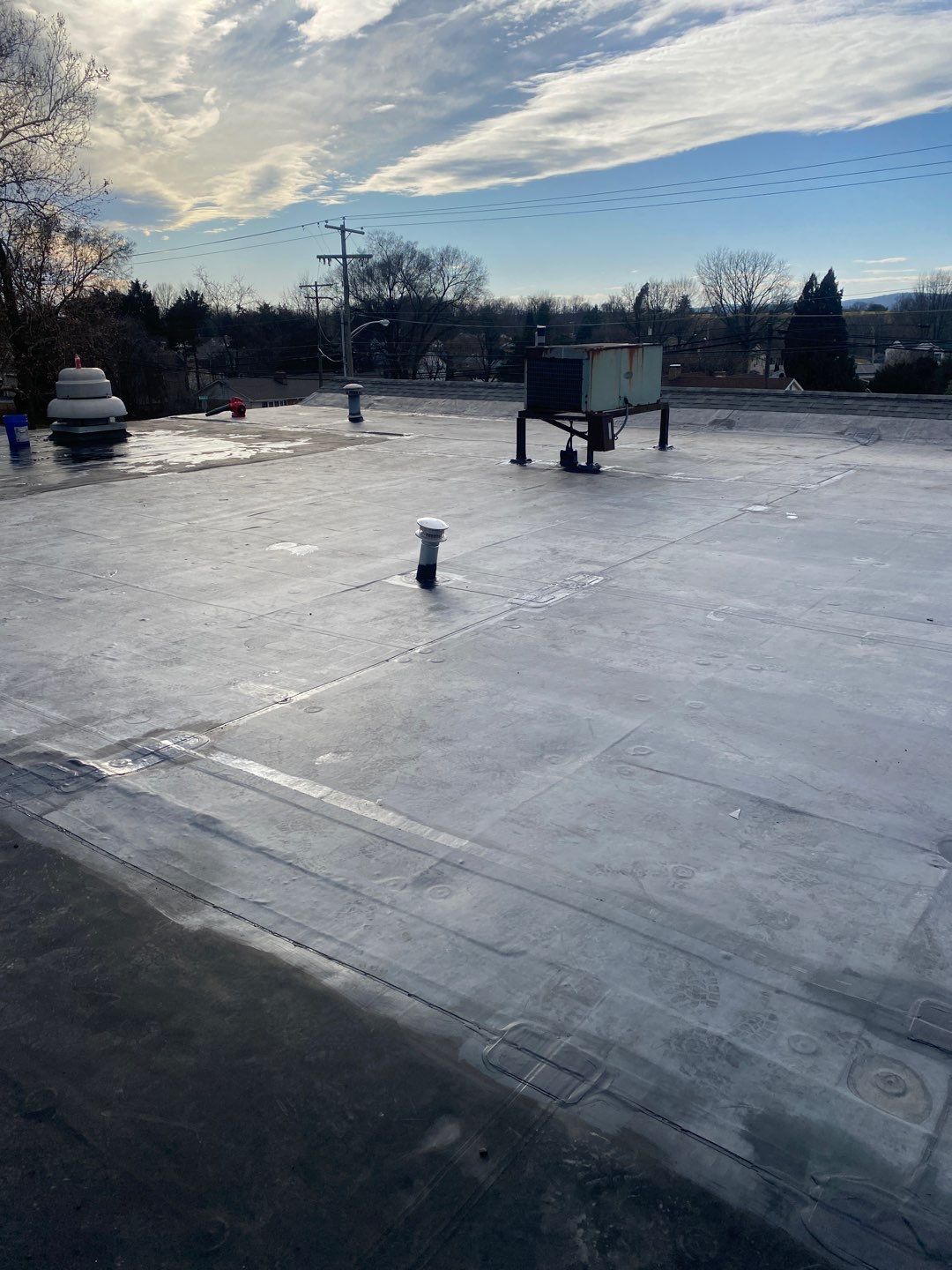 New commercial flat roofing system installed on North Main Street in Manchester, PA by Joyland Roofing.