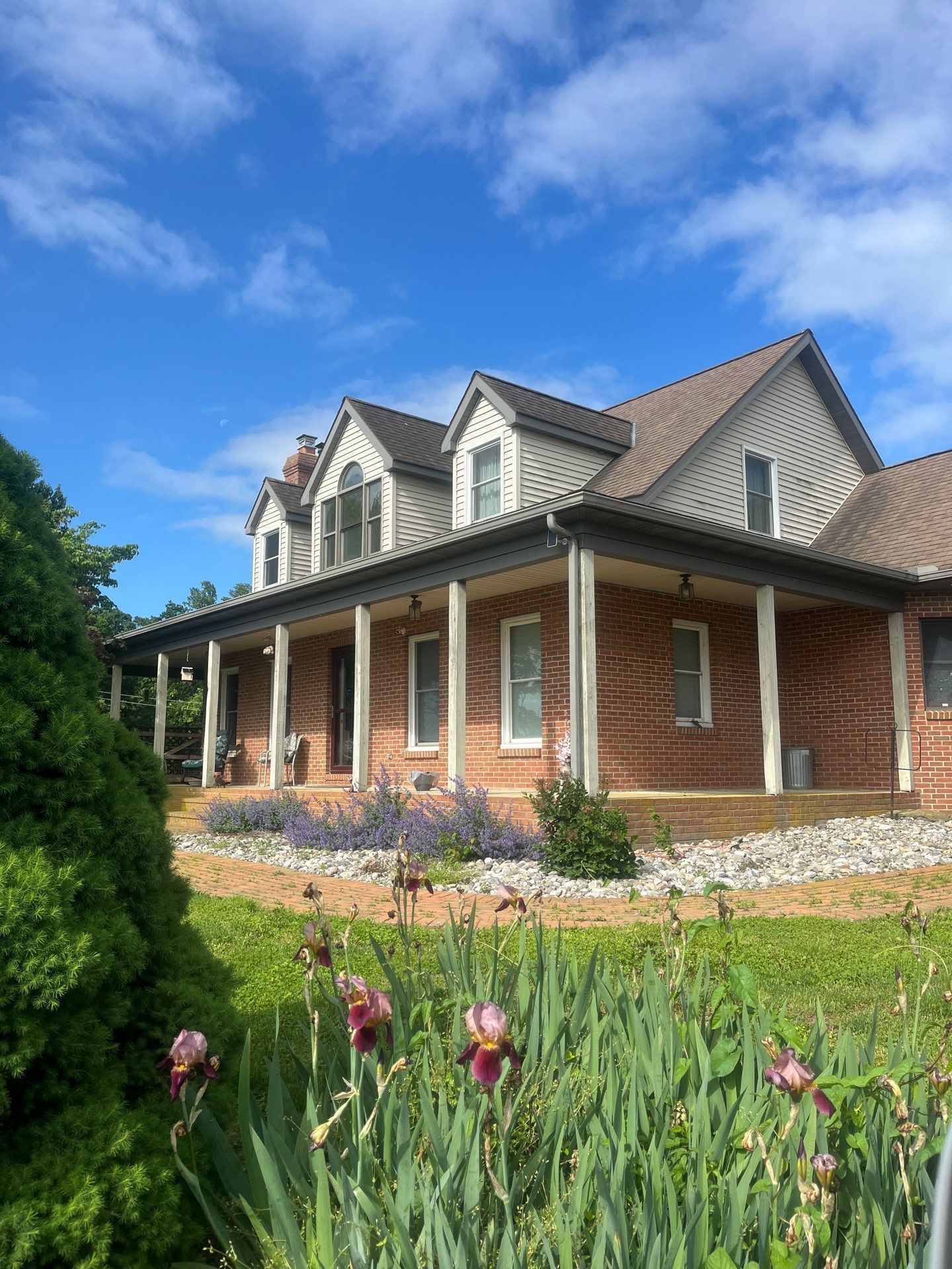 Residential roof with architectural shingles on a contemporary home surrounded by mature trees on Drywells Road in Quarryville, PA.