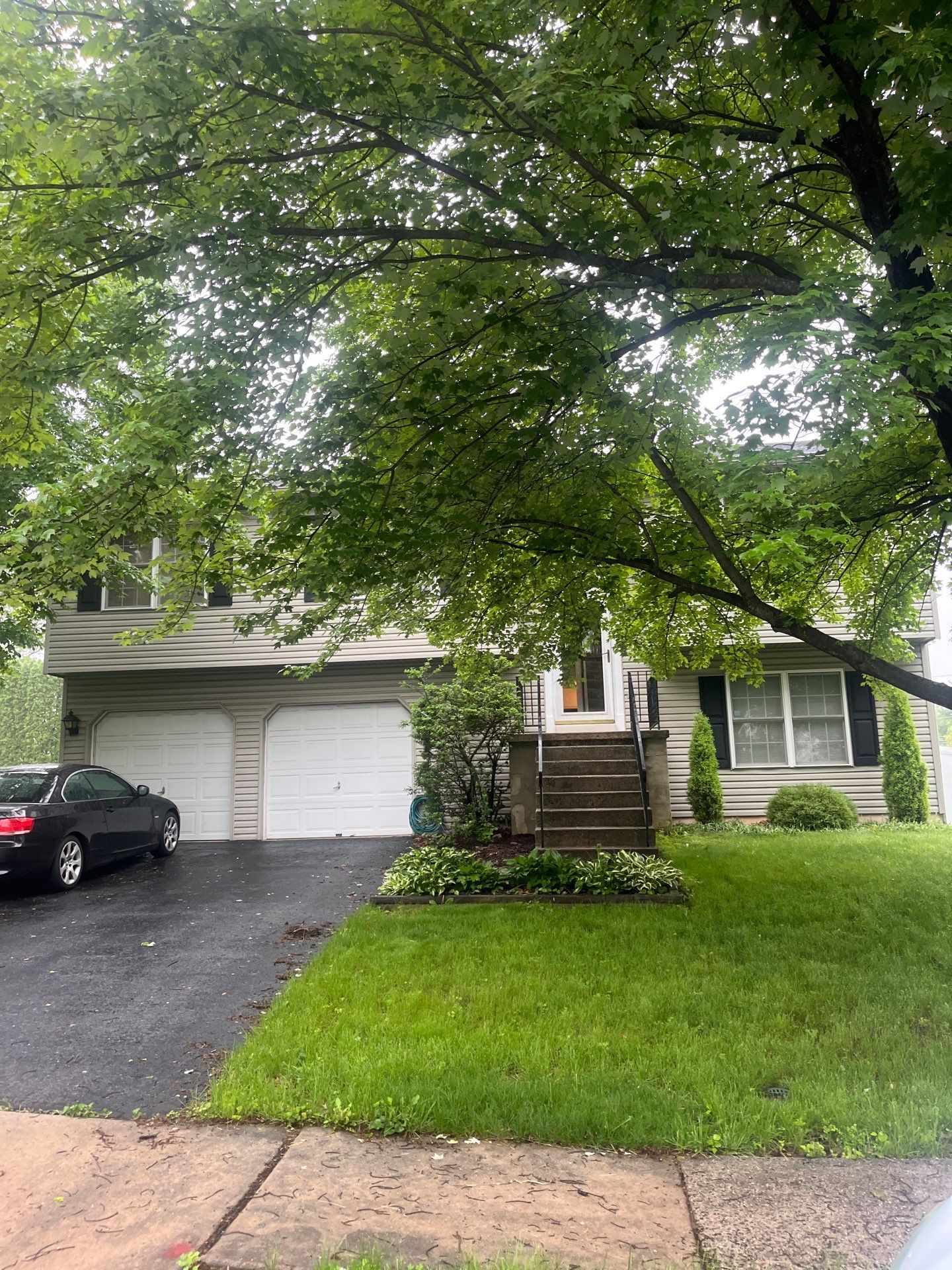 Residential home on Dogwood Drive receiving a complete asphalt shingle roof replacement by Joyland Roofing.