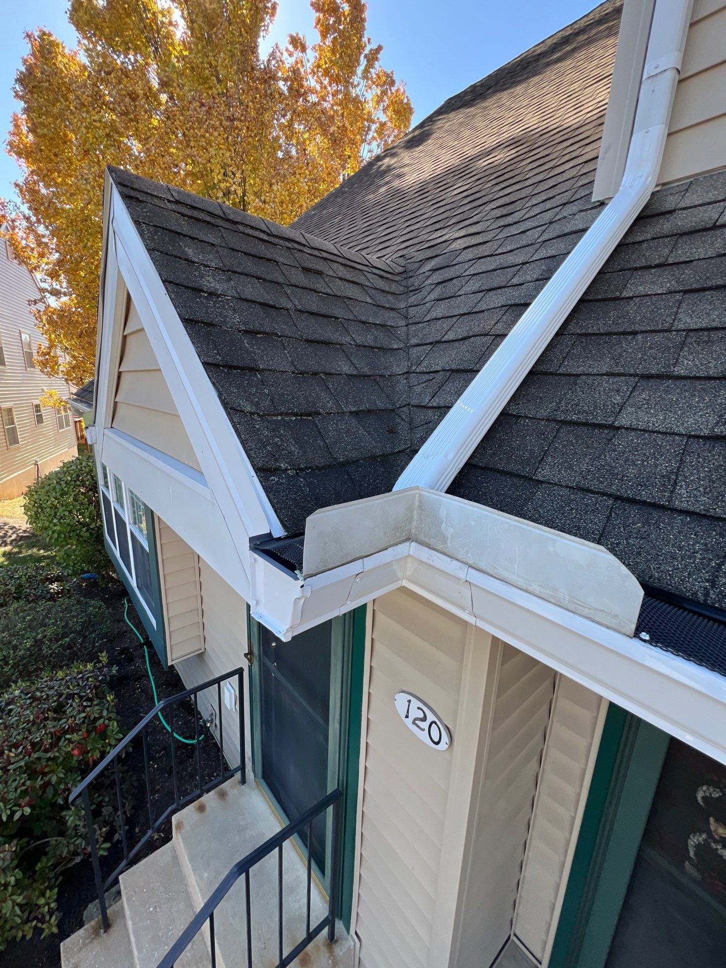 Front entry roof valley and gutter system inspected during an asphalt shingle roof repair project on Dover Court in Morgantown, PA.