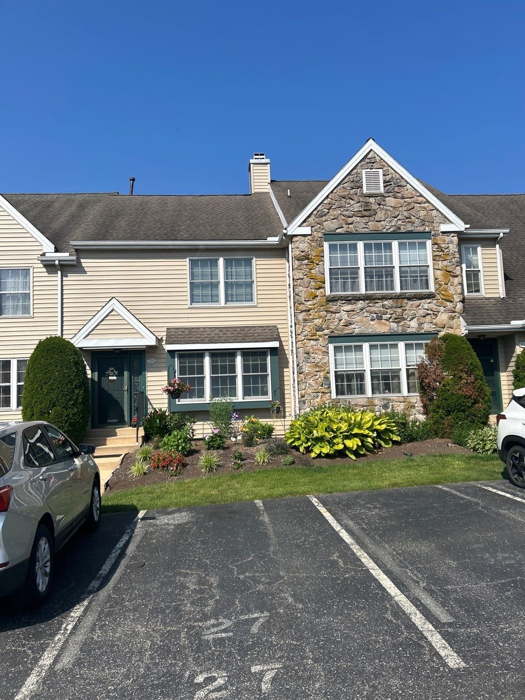 Townhome with a new architectural asphalt shingle roof installed during a roof replacement project on Dover Court in Morgantown, PA.