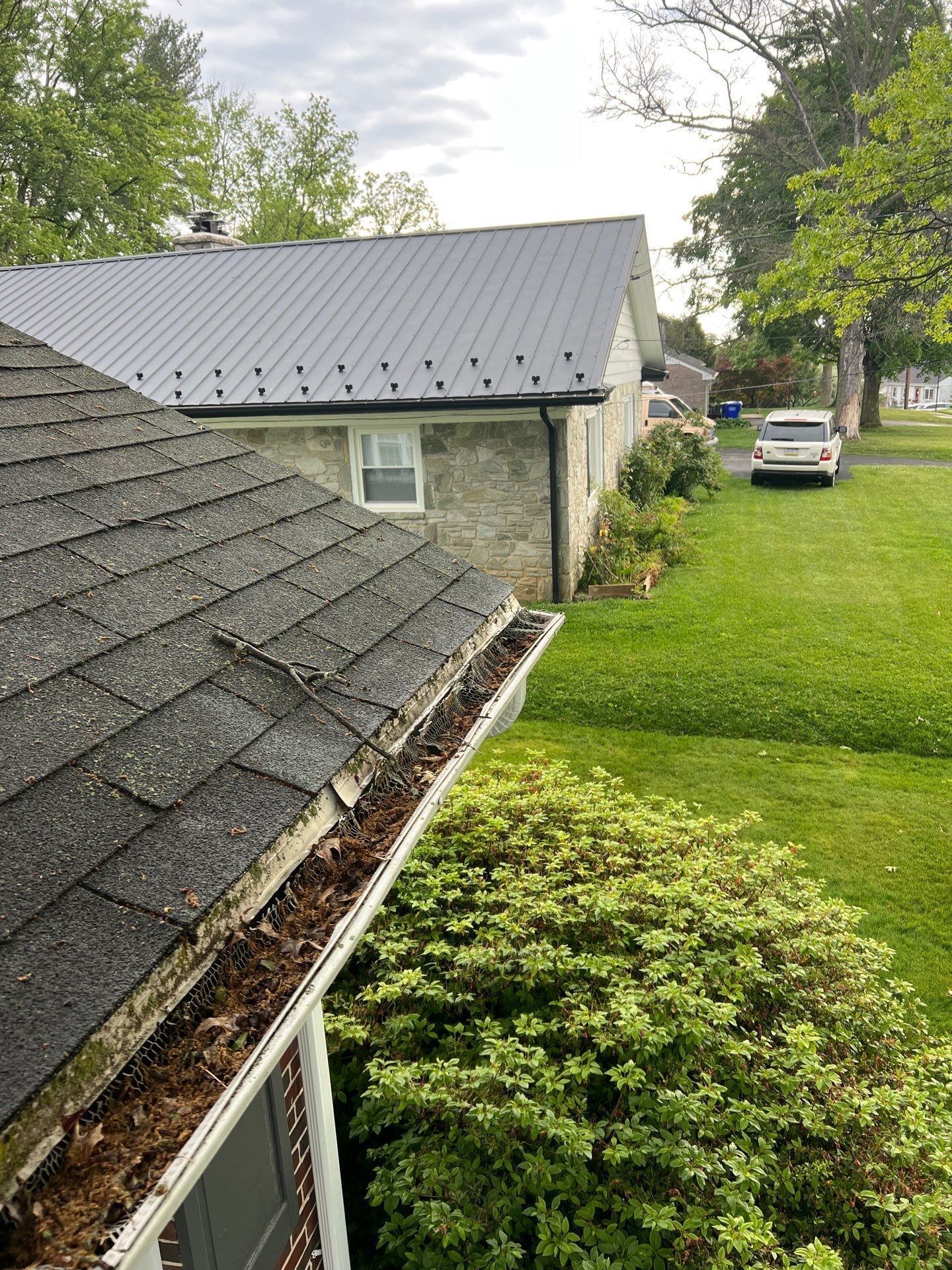 Roof replacement completed on East Charlotte Street in Millersville, PA featuring new architectural shingles and cleaned gutter system.