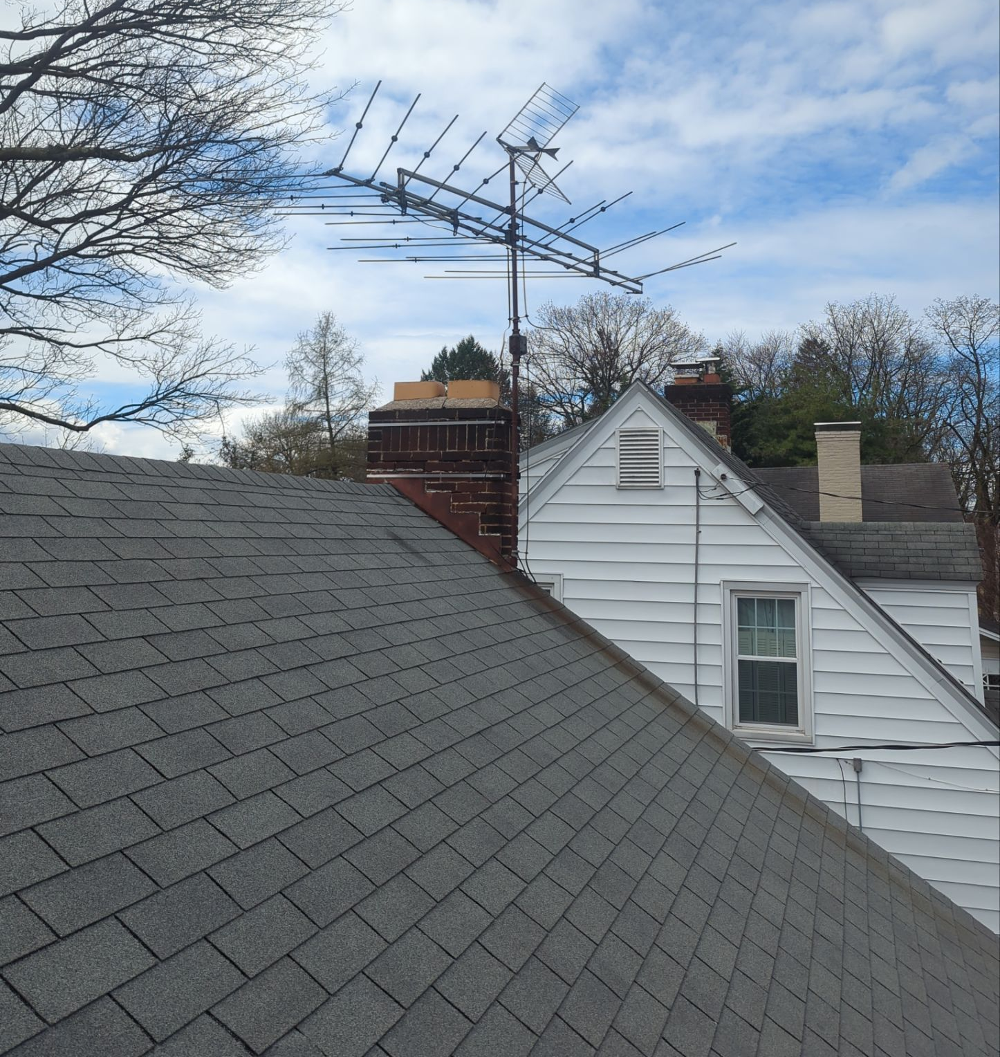Completed asphalt shingle roof replacement on a residential home along East Main Street in Shiremanstown, PA by Joyland Roofing.