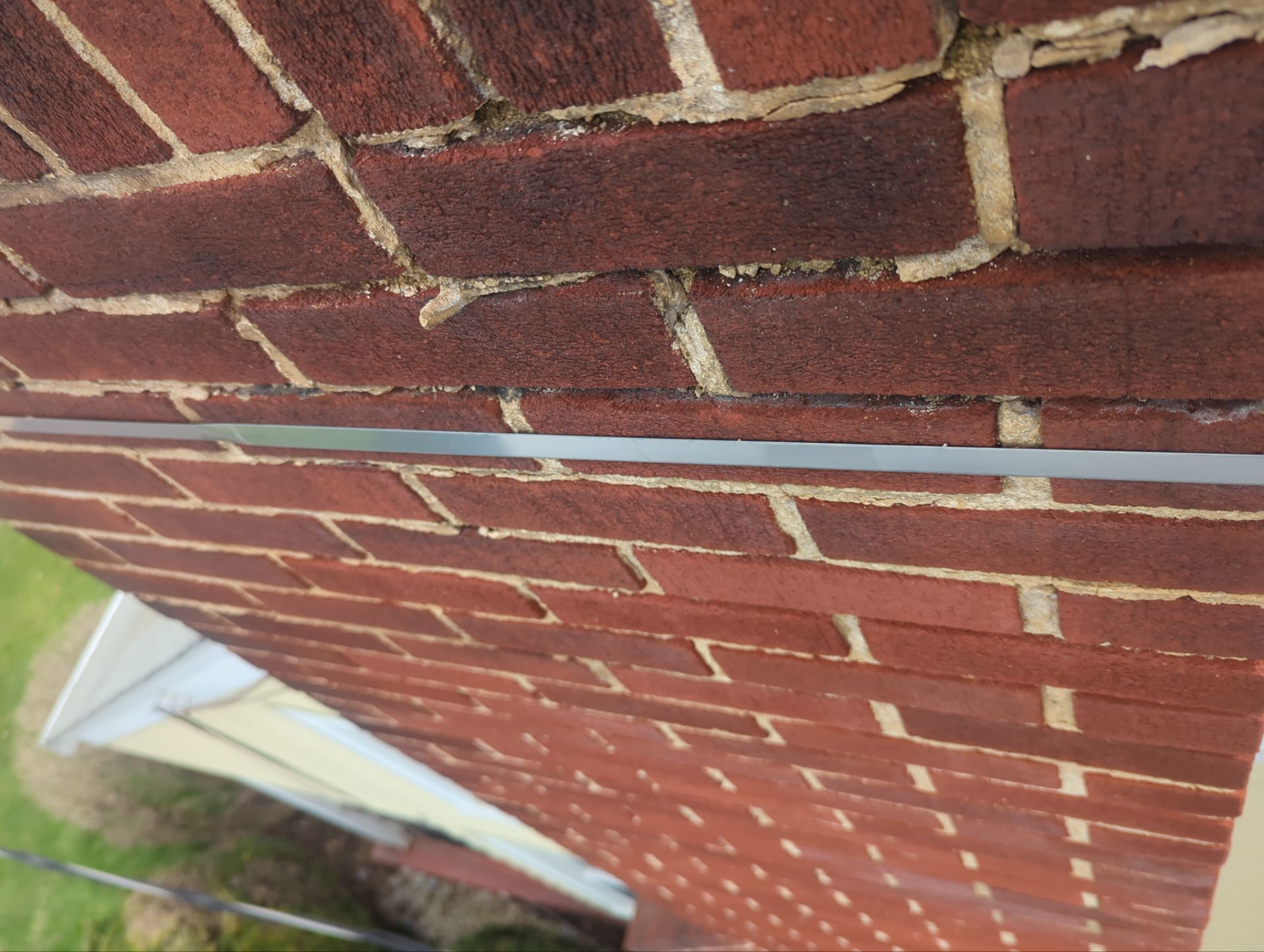 Close-up of deteriorated chimney mortar joints repaired on East Main Street in Shiremanstown, PA.