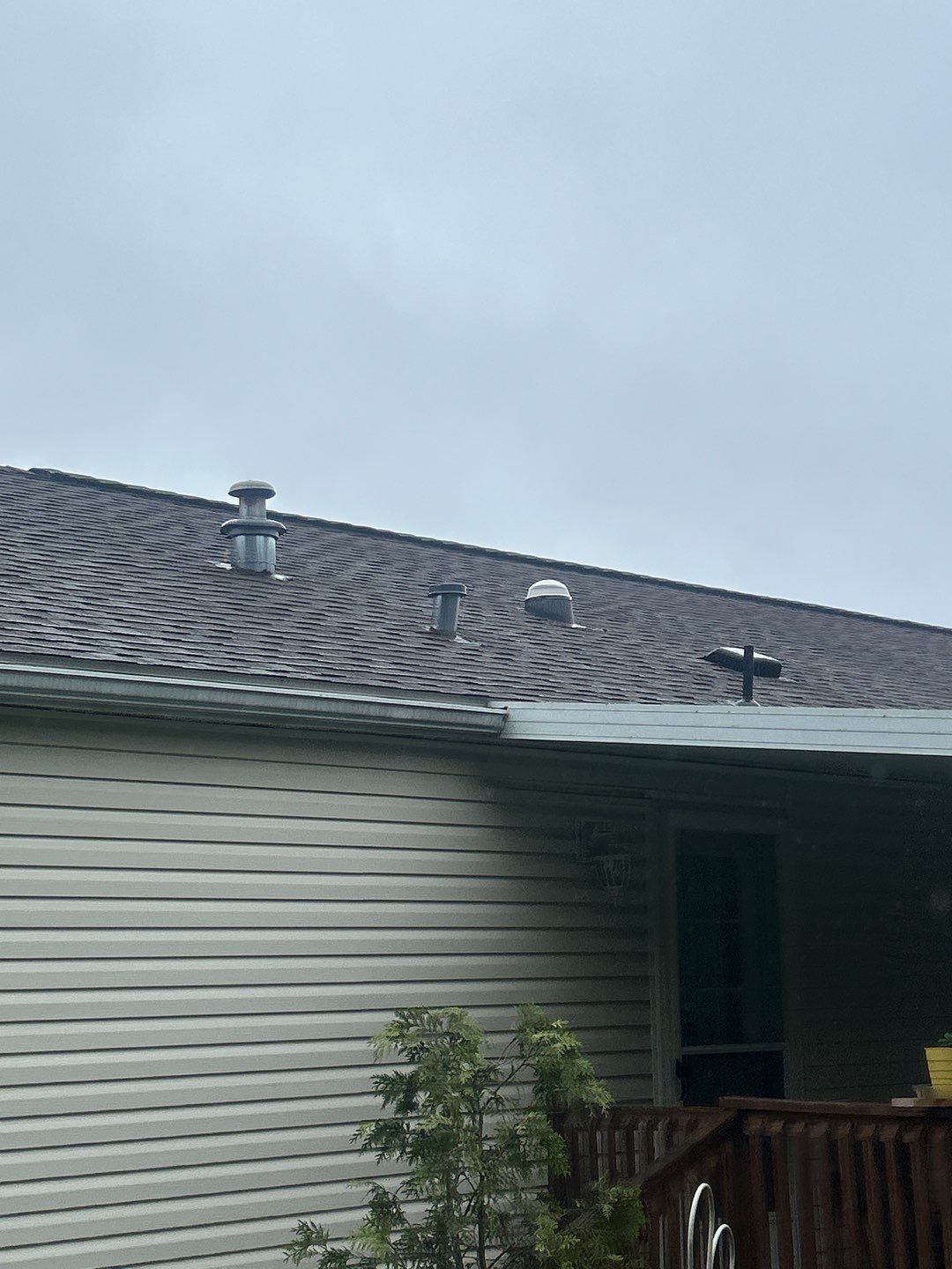 Asphalt shingle roof with multiple ventilation components following a replacement project on Elm Avenue in Hamburg, PA.