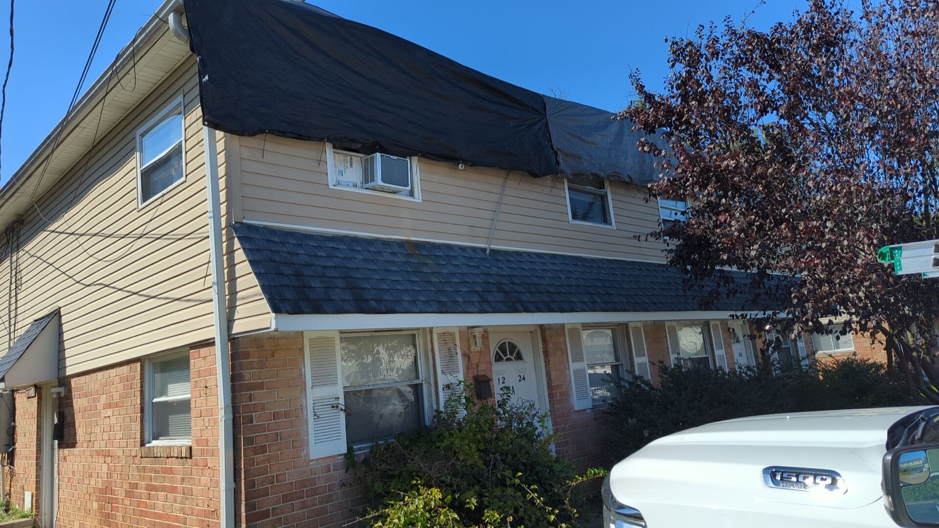 Emergency roof protection during exterior restoration on Ward Street in Chester PA