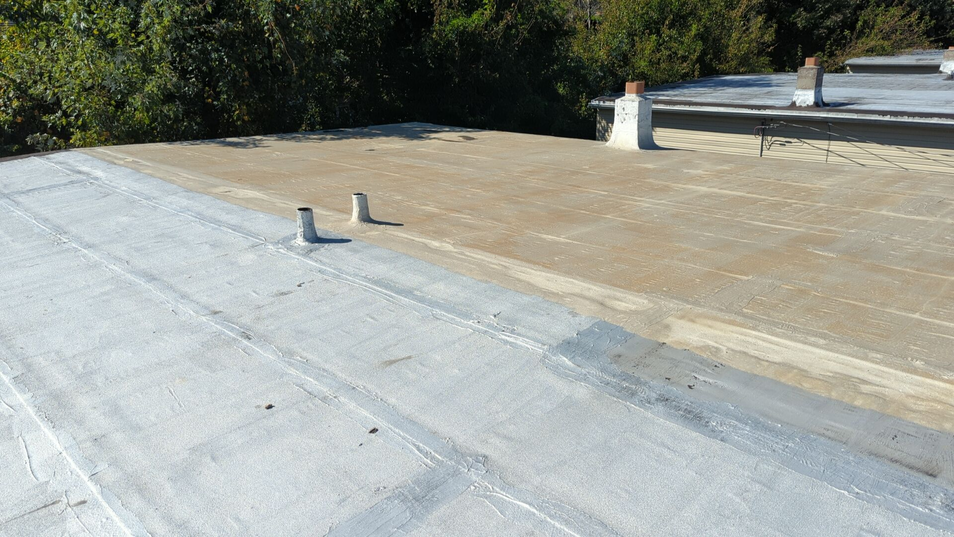 Flat roof coating and seam restoration on Ward Street in Chester PA