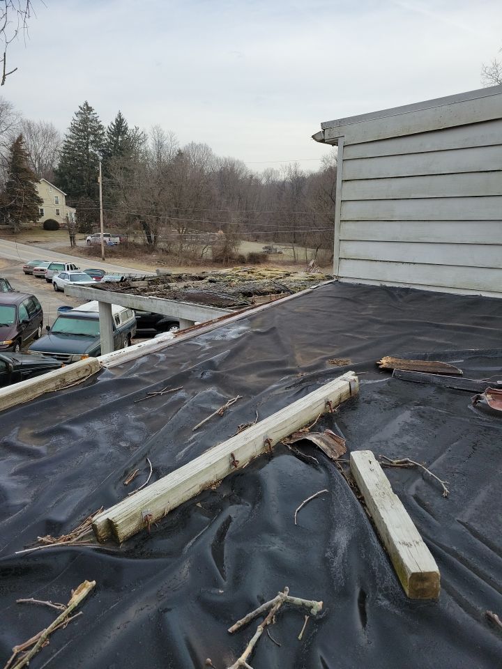 Aging flat roof with deteriorated roofing membrane on Cassel Road in Manchester, PA inspected before replacement by Joyland Roofing.