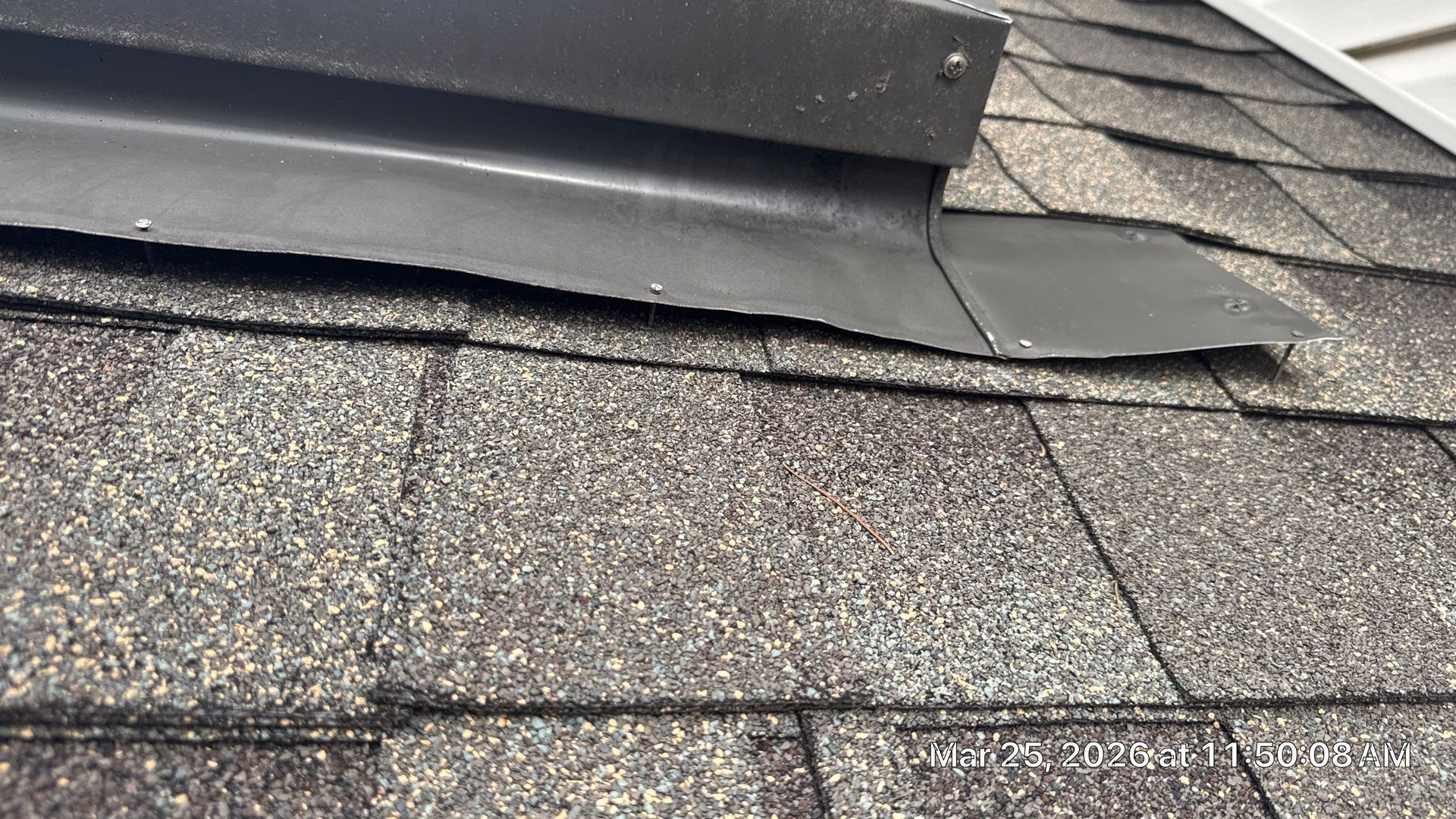 Professional roof repair with new flashing installation around roof vent on Fox Hill Drive by Joyland Roofing.